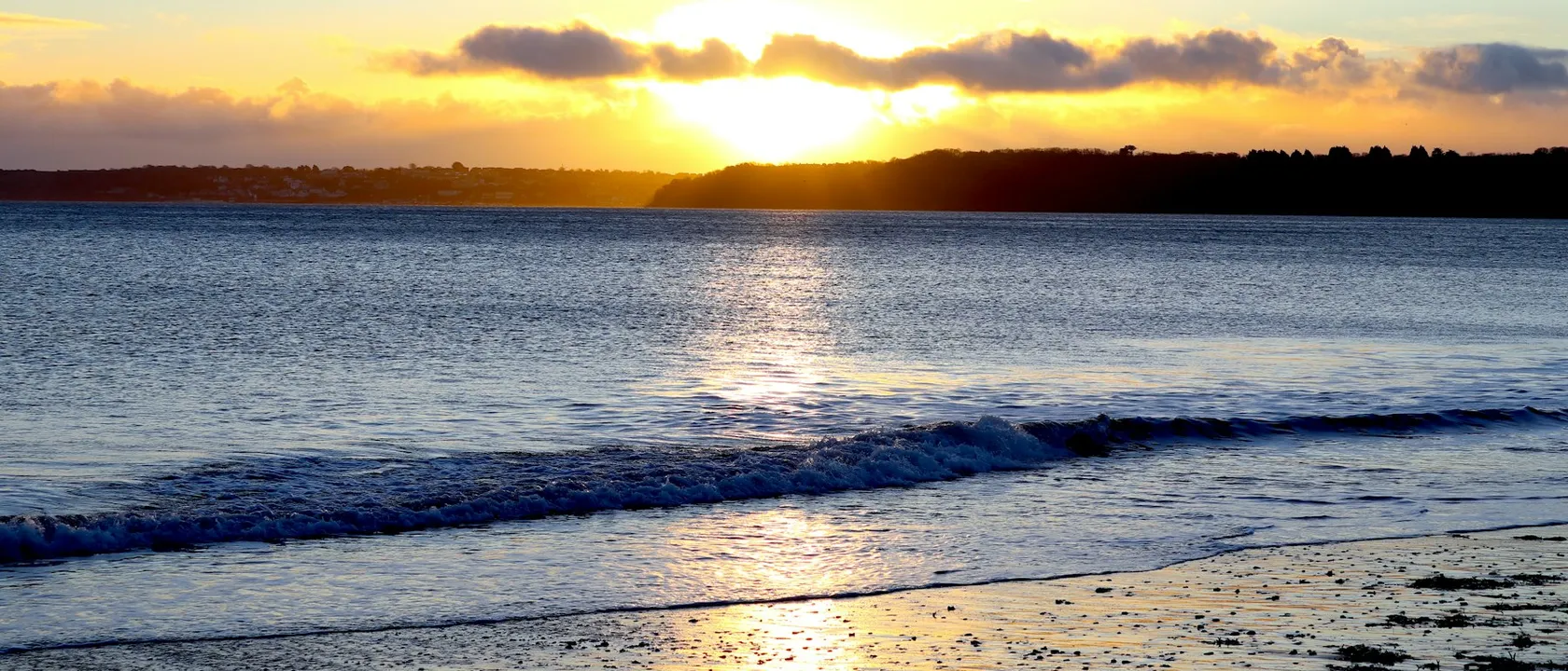 Sunrise over Paignton beach in Torbay - Web Design Paignton | Bloxli Web Design Paignton